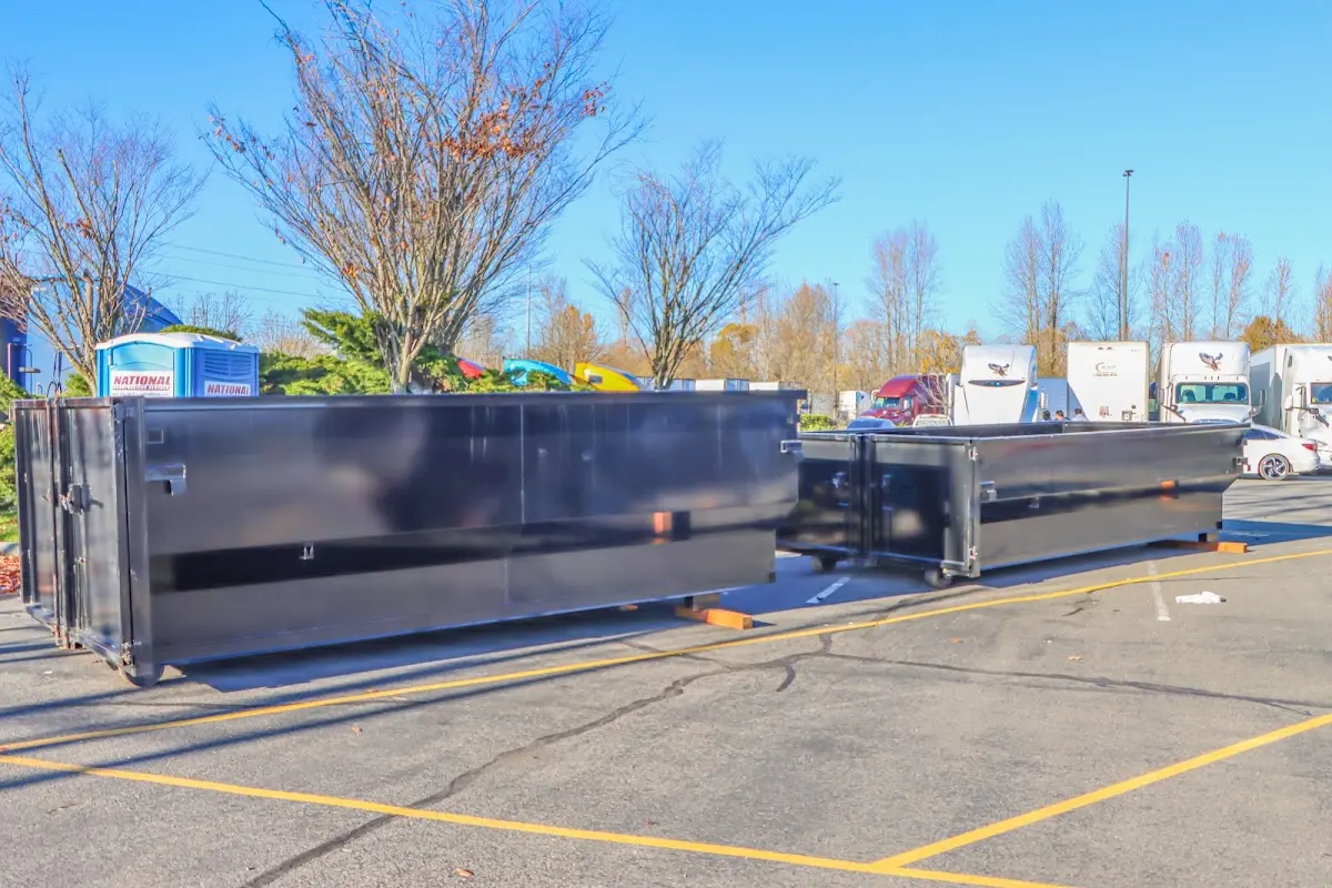 Professional dumpster rental service with roll-off container on residential driveway in Yorba Linda